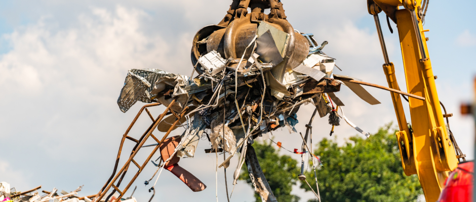 Close-up of a crane for recycling metallic waste on scrapyard