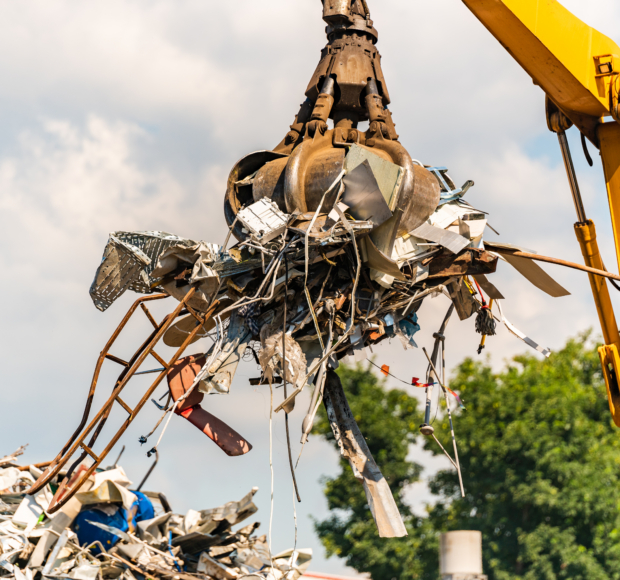 Close-up of a crane for recycling metallic waste on scrapyard